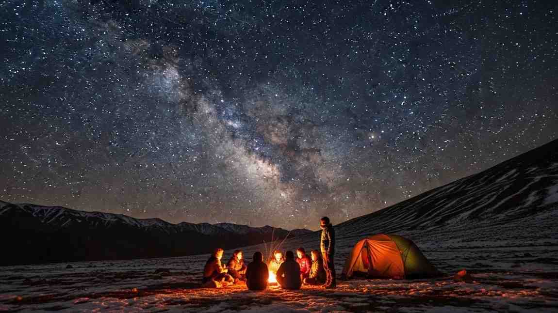 Person standing on salt flats under vast night sky, stargazing in India