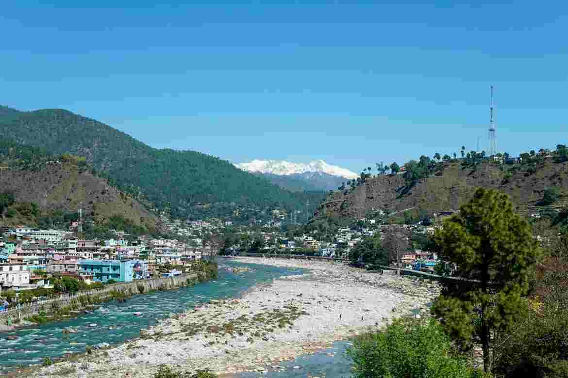 Riverside town view reflecting budget travel Uttarakhand during winter season Towno