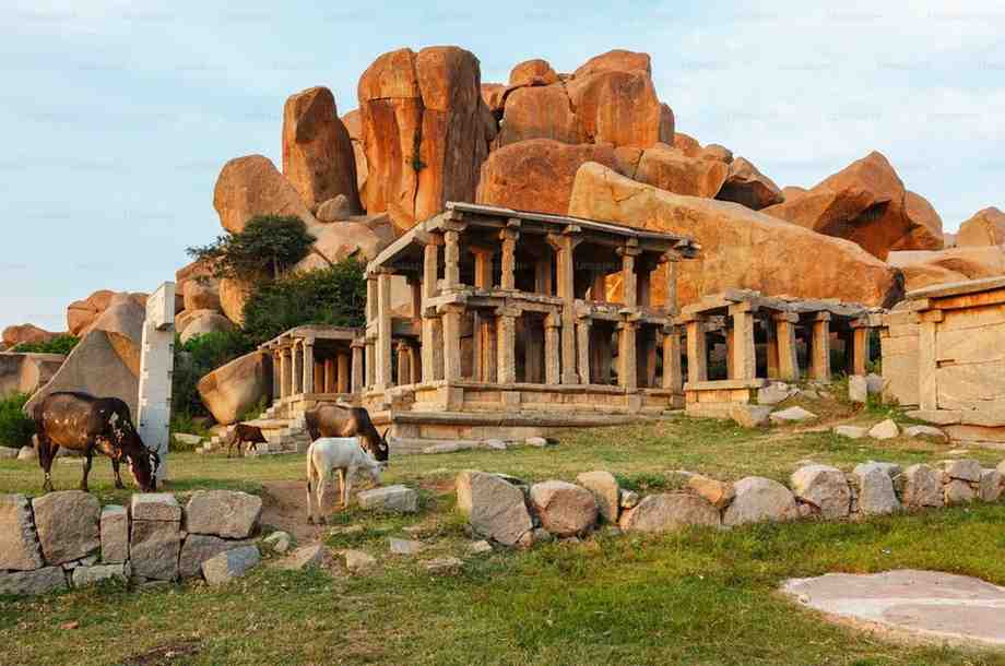 Hampi stone temple ruins among boulders highlighting Heritage Sites in India Towno
